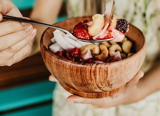 Bowl with fruits, nuts, and yougurt